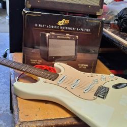 Huntington electric guitar like new, little used with its cable and new Acoustic A15 amplifier in its box