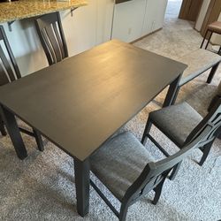 Dark wood dining table + 4 chairs and bench