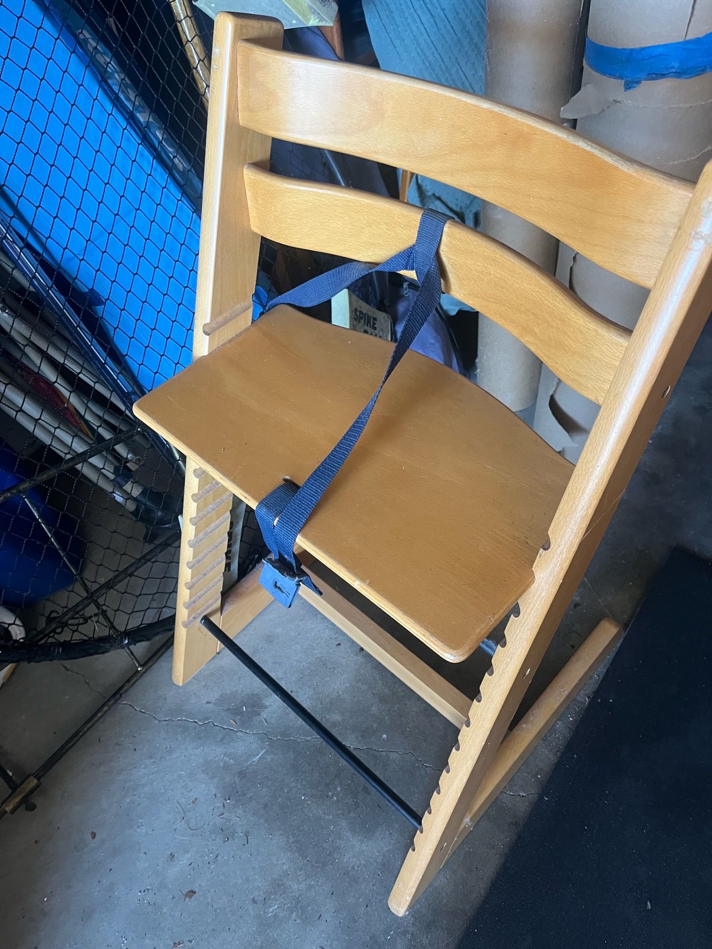 Stokke Tripp Trapp high chair in a natural wood finish.