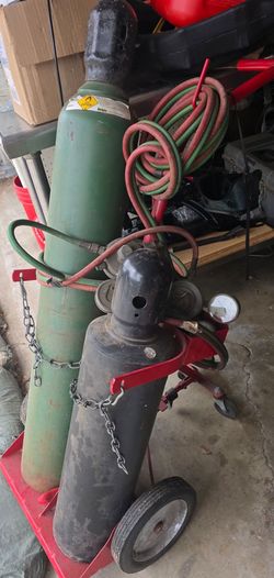Oxy-acetylene welding or cutting torch kit mounted on a portable hand truck.