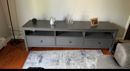 Gray TV stand with drawers and shelves