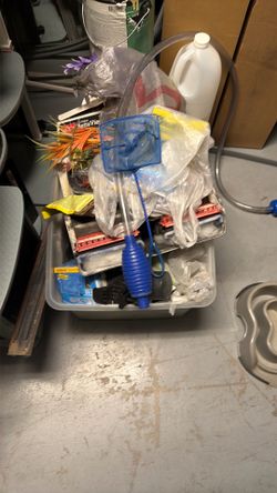 Two boxes of fish supplies, fish filters, nets decoration, etc.