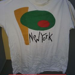 Used 1992 lyon design new york white large t-shirt, single stitch , made in usa , there s tears , needs restitch and stains h13br 20s 8x8x1 8oz