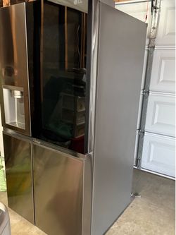 LG Side-By-Side Refrigerator with Instaview Glass, Craft Ice, and Recessed Handles in PrintProof Stainless Steel