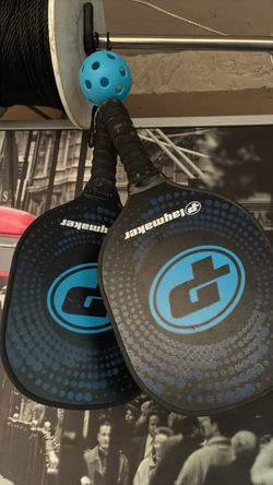 Pair of Pickleball paddles and ball