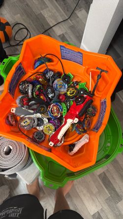 A bunch of valuable beyblades with the 2 arenas and multiple launchers