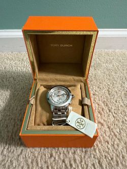Beautiful brand new tory burch women watch with brand new battery. (HURRY BEFORE ITS GONE!)