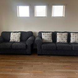 Two Navy Couches With Accent Pillows 