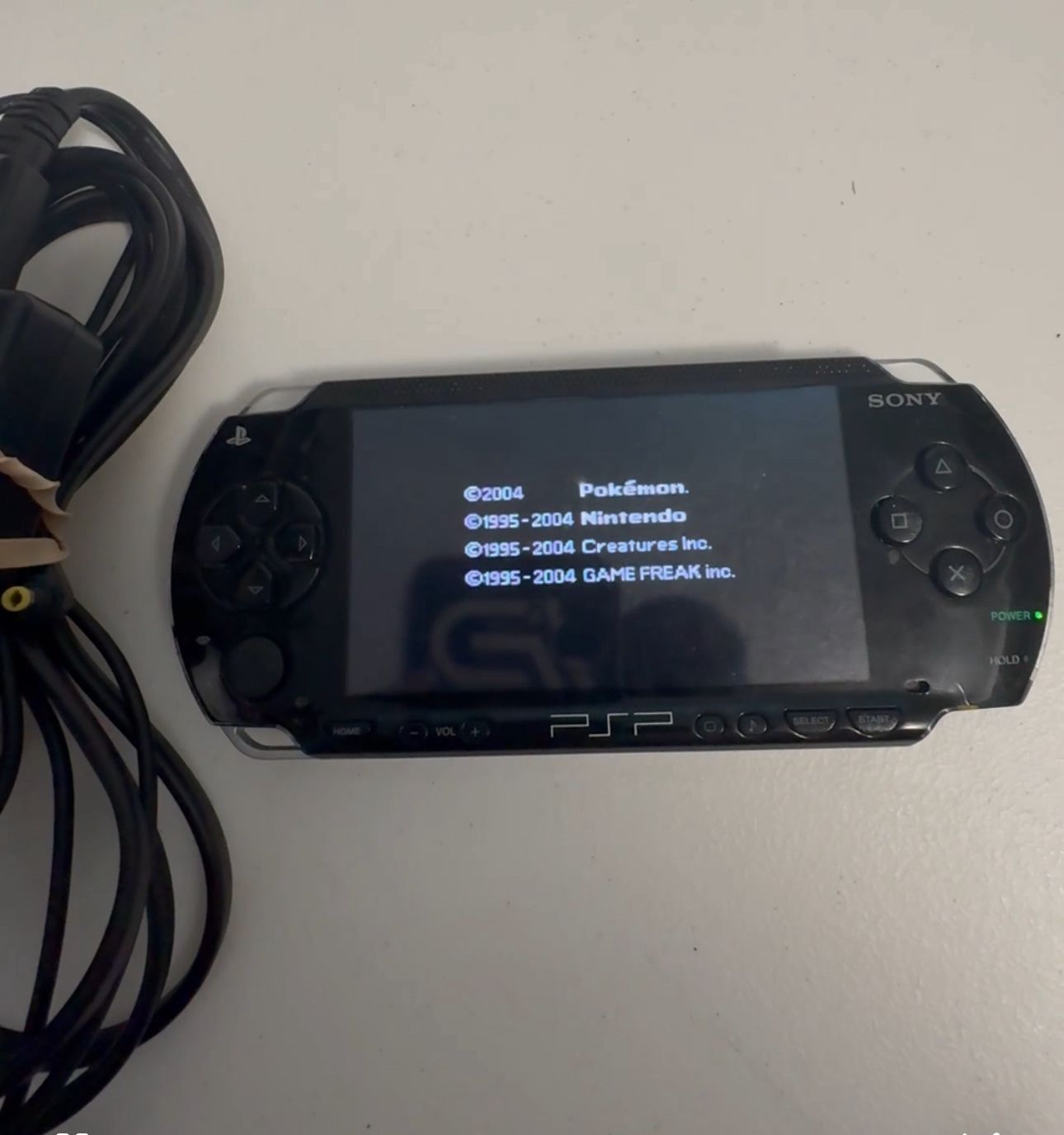 Psp -1000 128gb with charger & memory stick adapter
