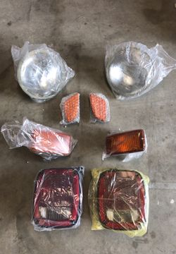 99 Jeep Wrangler headlights, running lights, side markers and tail lights. 150$ OBO. Used, but in very good condition.