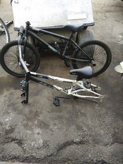 Two 20 inch bicycles black one Hyper bike Co spinner pro model