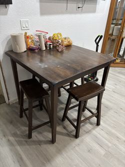 4 Stools And A Table