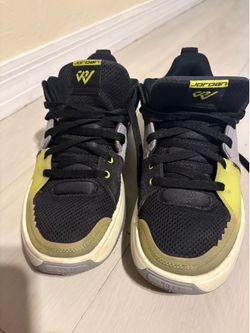 Jordan One Take 5 PF sneakers feature a vibrant "Cyber" green accent on the eyestays.