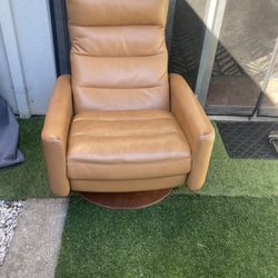 Orange leather recliner chair
