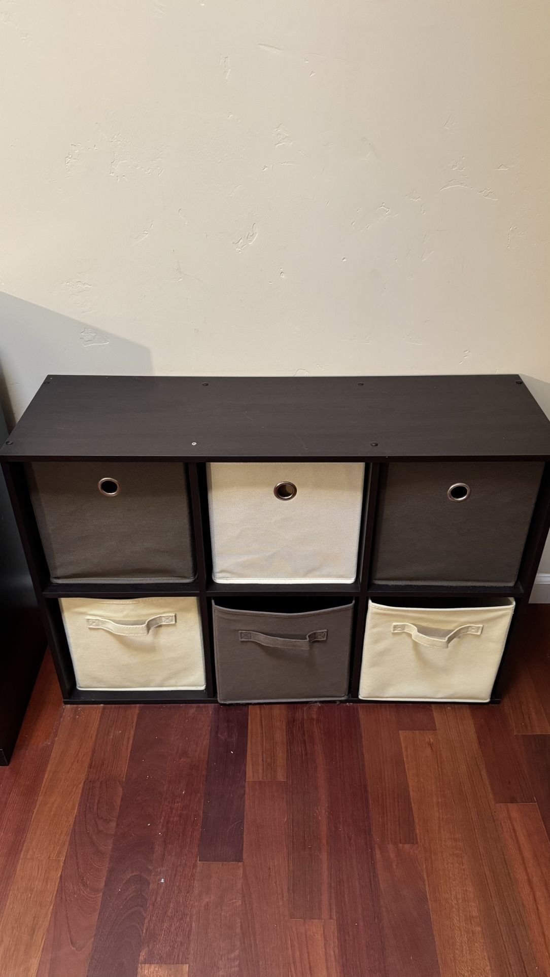 six-cube organizer with a dark wood finish and fabric storage bins