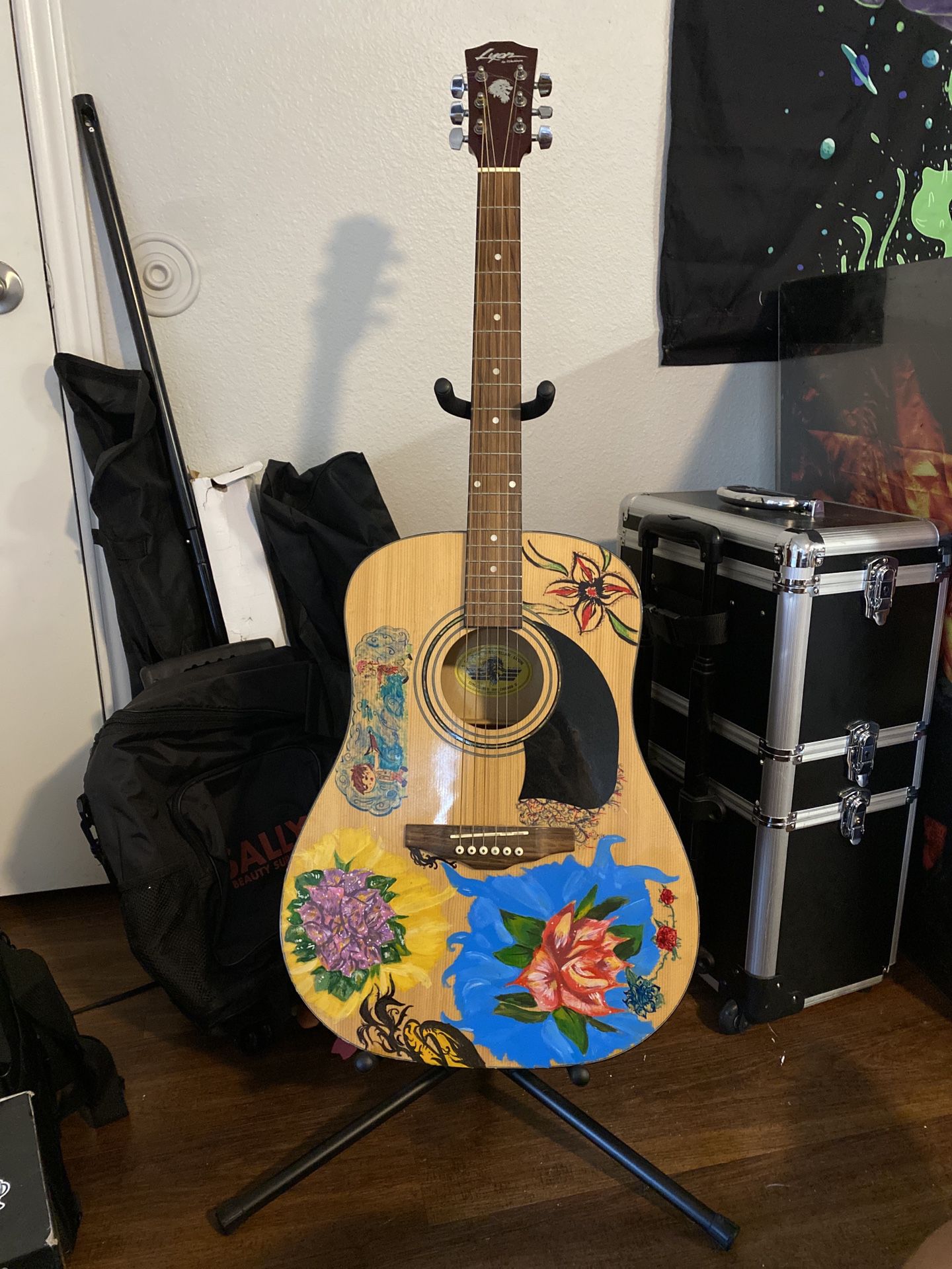 Acoustic guitar with stand and marvel picks