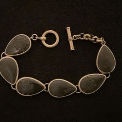 7” Goldtone Bracelet With Black Teardrop Shapes With Designs,by LC