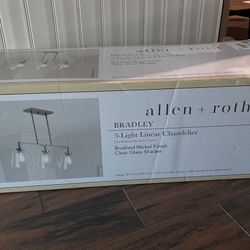 Allen & Roth three light linear chandelier brush nickel finish with clear glass shade.  