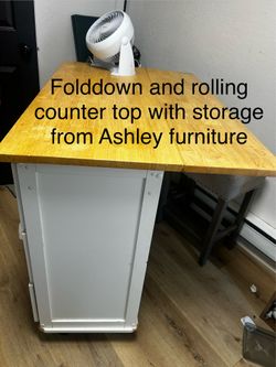 Rolling and folding counter with storage