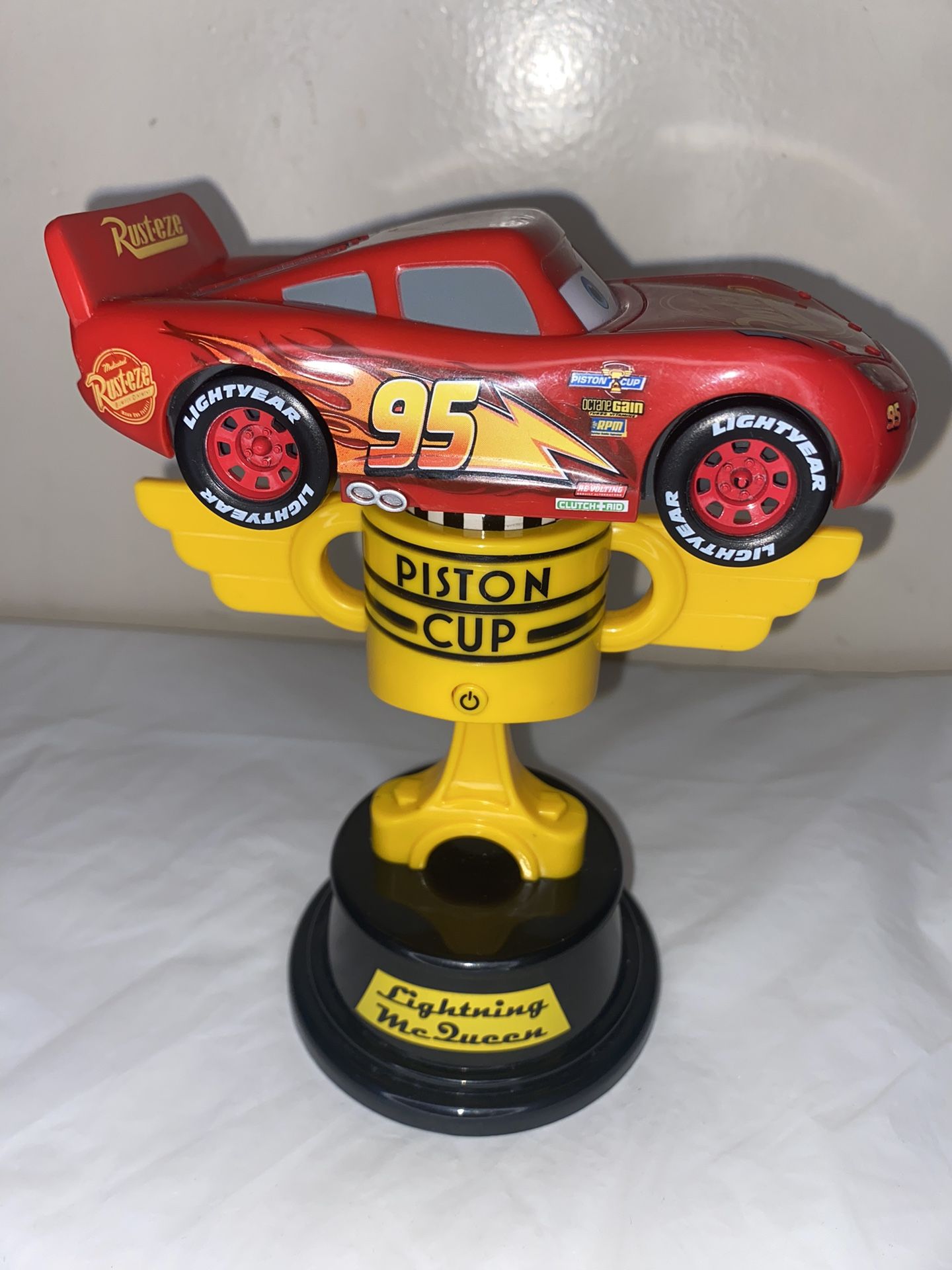 Disney Pixar Cars Light Up Spinning Car Lightning McQueen Piston Cup