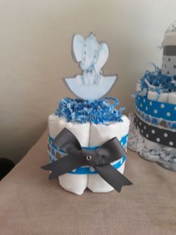 Mini diaper cake centerpieces tables