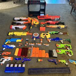 22 nerf guns with accessories and an organizer 