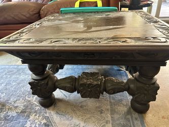 Carved wood coffee table
