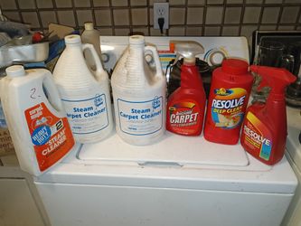 Six jugs & bottles of carpet cleaning supplies
