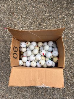 Box of used golf balls