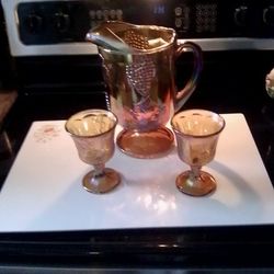 Carnival Glass Set 8 Glasses. & Pitcher 60.00