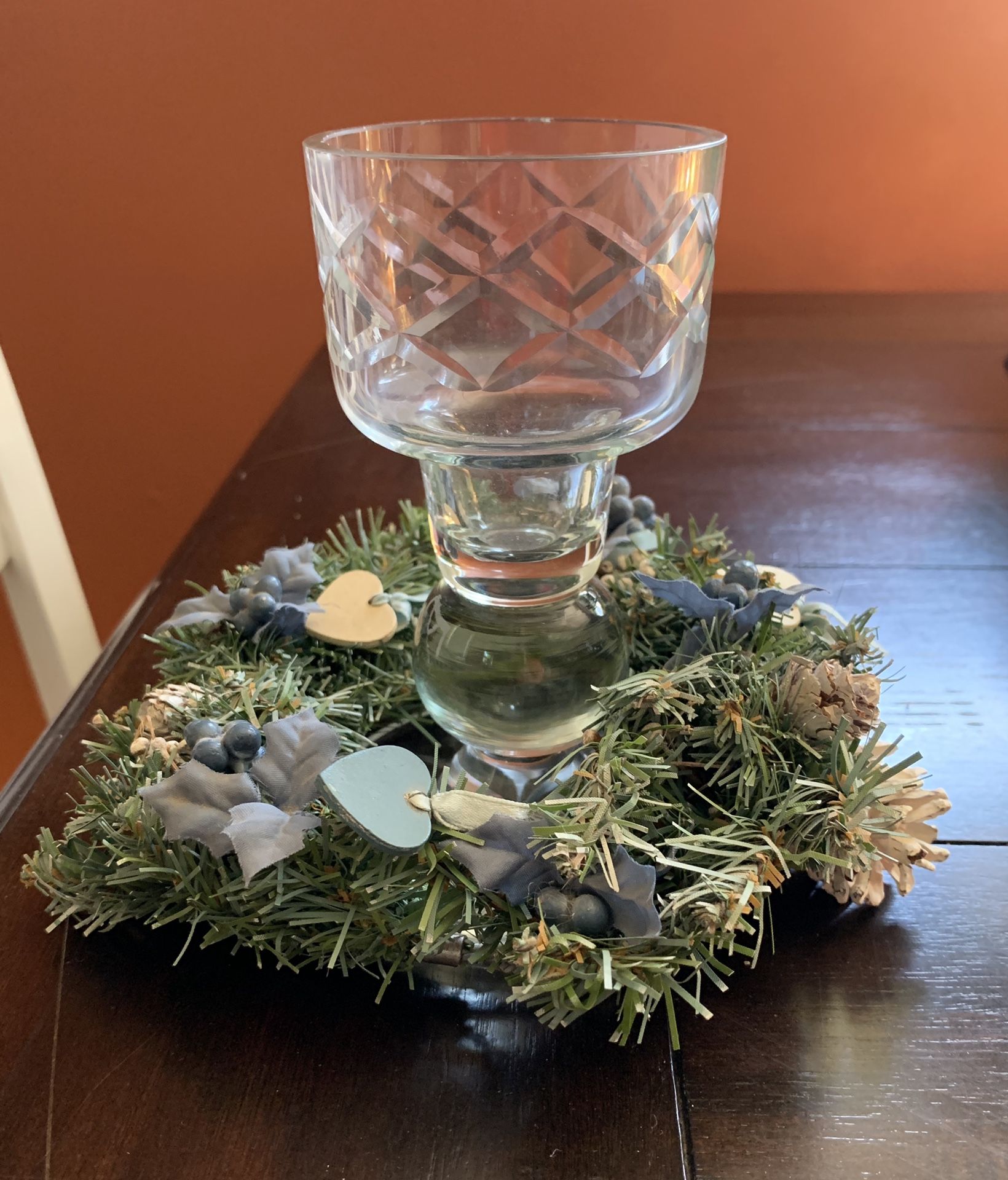 Candle holder with winter decor.