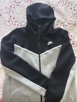 grey and black nike tech