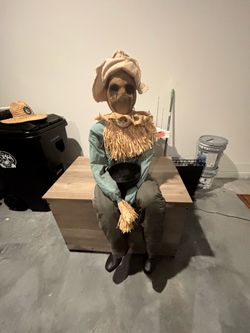 Sitting scarecrow
