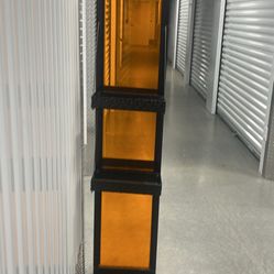 Solid heavy metal display rack with tinted plastic dividers and 4 shelves. The shelves are 6x12 and 2 inches deep. Lot#0.5SEP2324 stor3 pick up addres