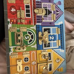 Melissa and Doug lock and latch sensory toy