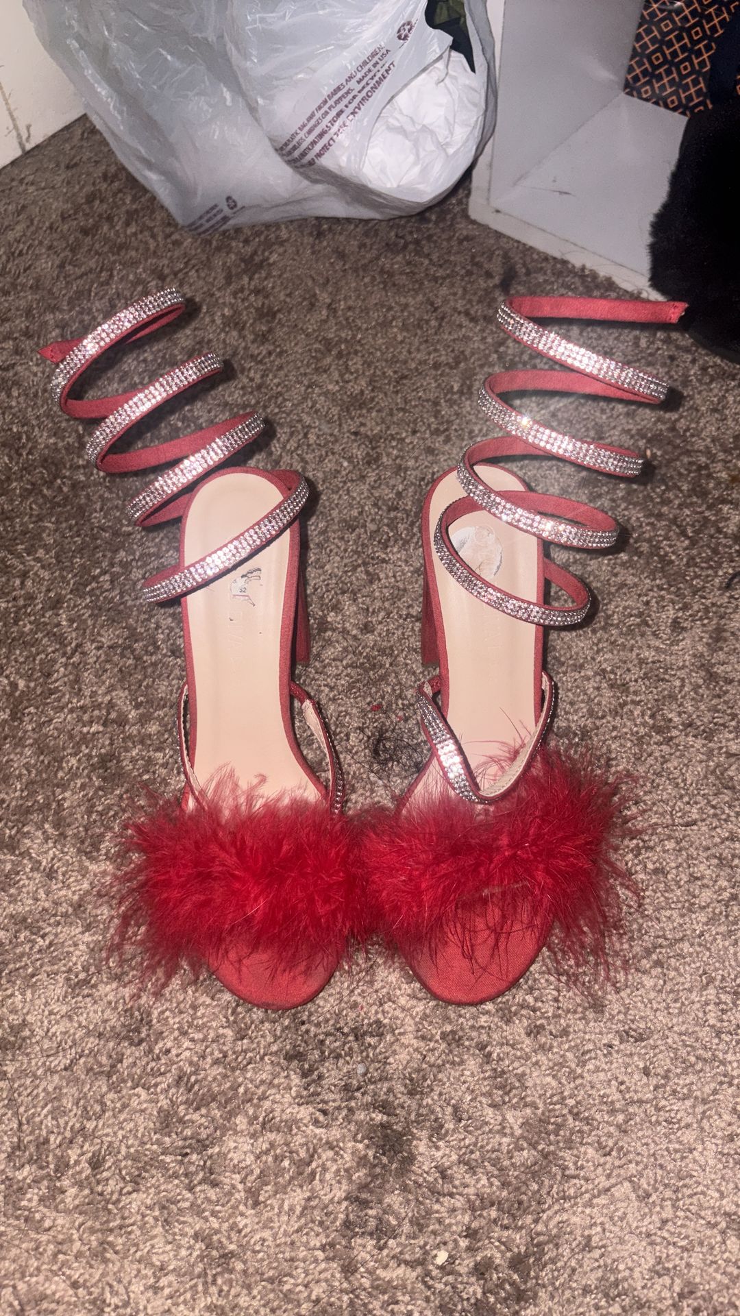 Red heels with straps and fluff