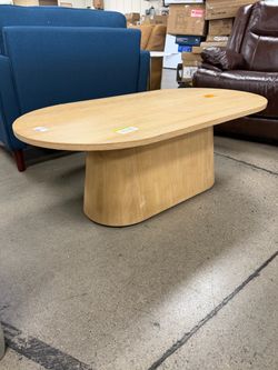 Leander 48 in. Oak Oval Wood Coffee Table with Cone-Shaped Pedestal Base