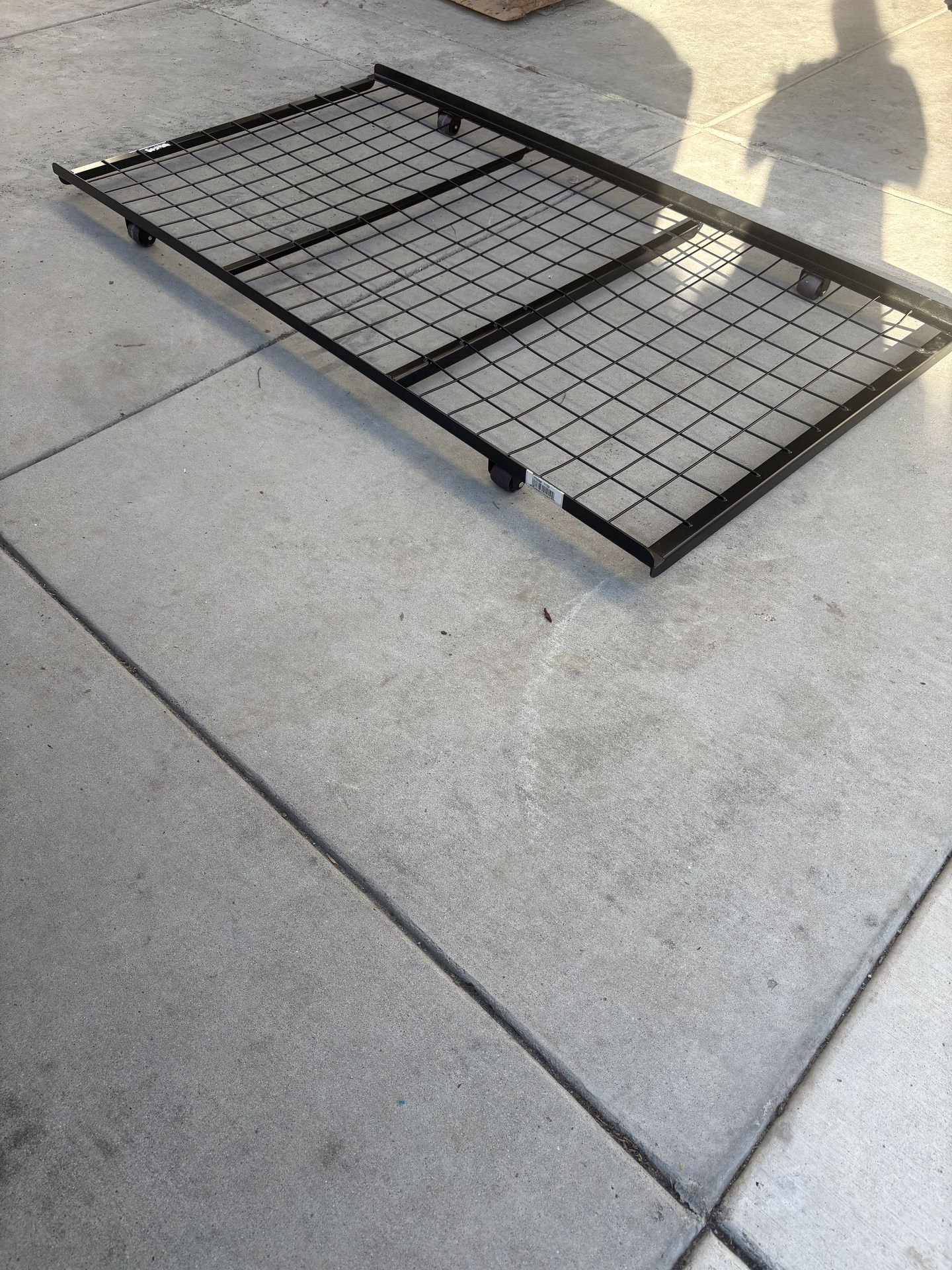 Roll-out twin metal bed frame