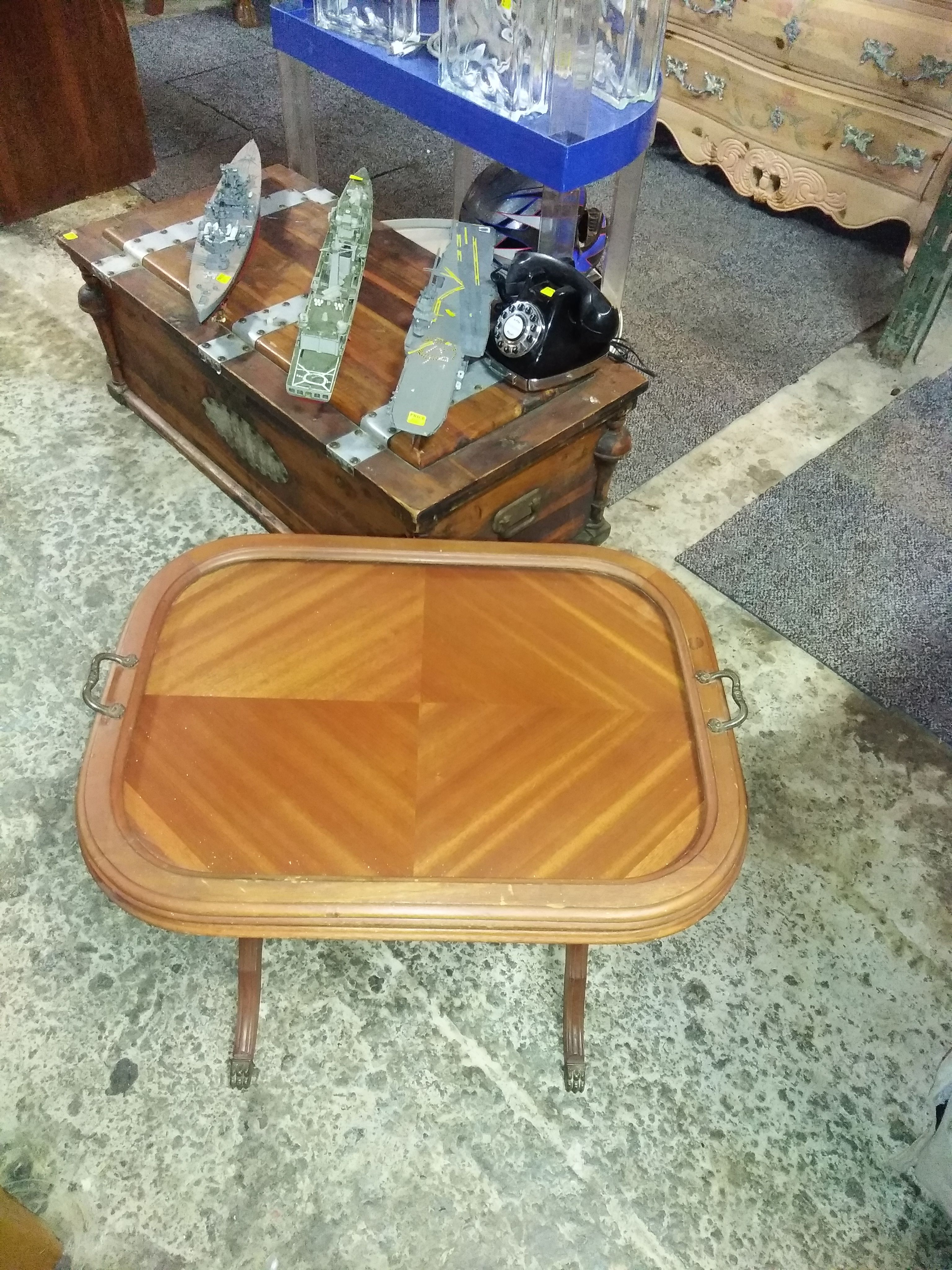 Small wooden end table with a glass serving tray and claw feet for sale