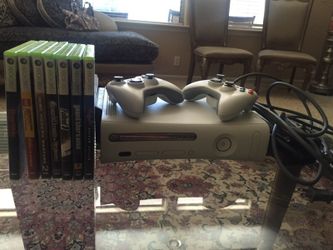 Xbox 360 with two controllers and 7 games