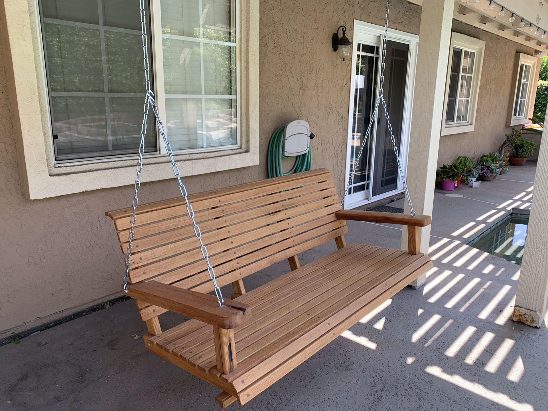 RED OAK PORCH SWINGS, 50” Wide, With Chain, Natural Oil Finish. $300