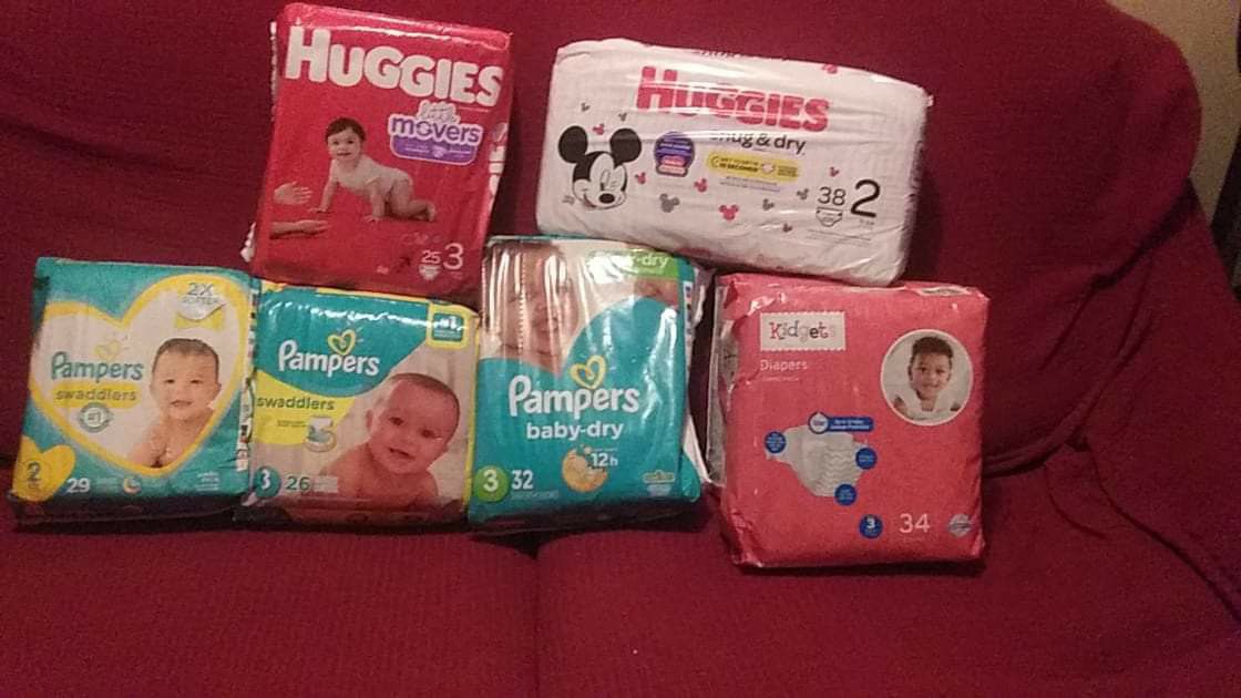 Diapers ,2 pcks of huggies size 3 & 2, 3 pcks of pampers size 1,2,3 & 2 pcks of kidget size 3