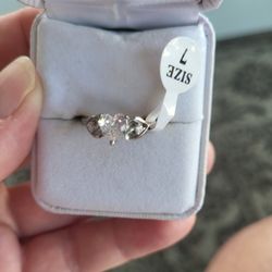 Heart Shaped High Quality CZ Diamond Ring Set In 3 Prongs With Diamond Chips In Each Side Inside Hearts!  Size 7,  Picture Does Not Do Justice!
