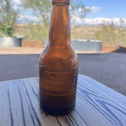 Antique 1920s Uncle Jo's beveled 8oz glass soda bottle "In Brown bottles"