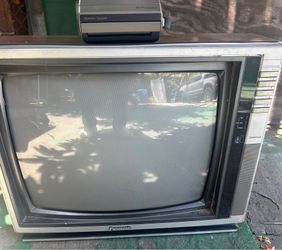 Vintage Panasonic 19 “ tv And vintage Polaroid camera