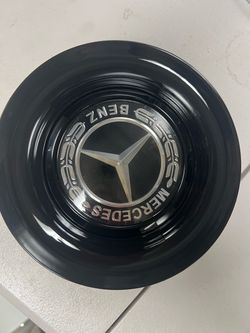 A set of Mercedes floating caps