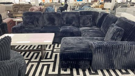 Elevate your living space with this Luxurious black sectional