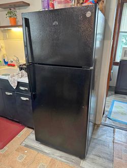 Brand new black refrigerator delivery fee curbside drop off