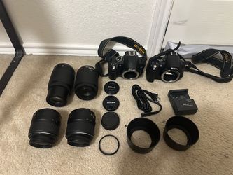 Nikon D3000 DSLR Camera set with 55-200mm, 18-55mm lenses, and accessories