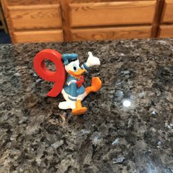 Vintage Walt Disney Company Donald Duck Rubber Figure With a Number 9. Size 2 inches tall Preowned excellent condition.